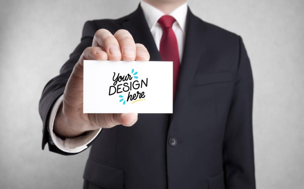 Corporate Businessman Holding Visiting Card PSD Mockup File